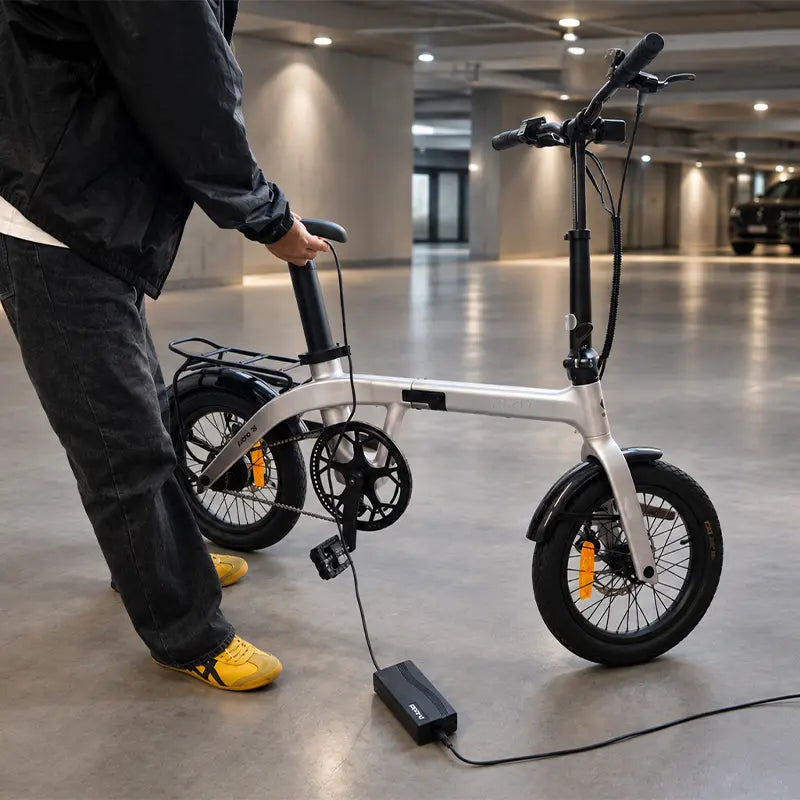 Rider charging an electric bike battery